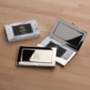 Custom engraved metal card holders for professional business cards.